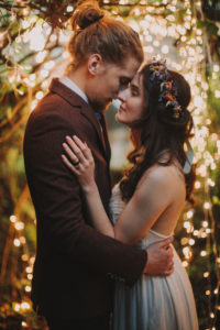 Bridal couple at alternative outdoor wedding, half profile Bridal couple at alternative outdoor wedding, half profile